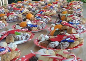 a table full of large holiday cookie plates