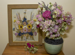 dried flowers in opaque vase